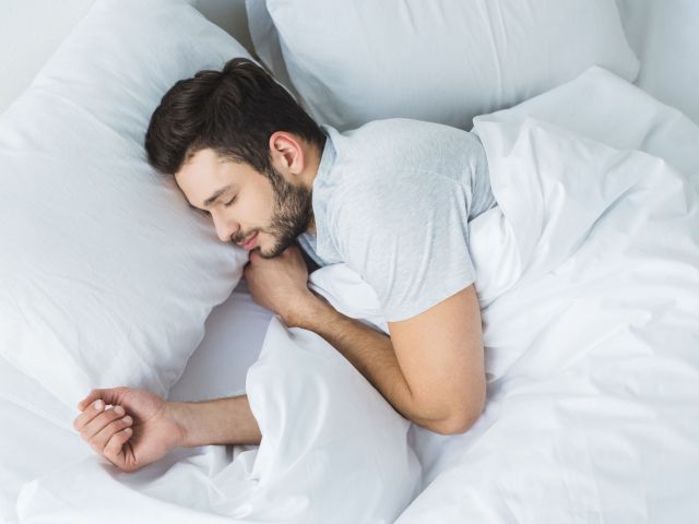 sleeping man with periodic limb movement disorder